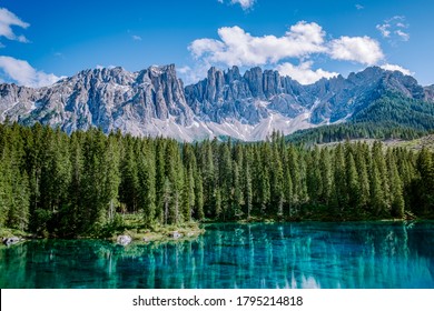 bleu lake in the dolomites Italy, Carezza lake Lago di Carezza, Karersee with Mount Latemar, Bolzano province, South tyrol, Italy. Landscape of Lake Carezza or Karersee and Dolomites in background