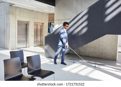 Blind African Businessman With Cane At A Business Event