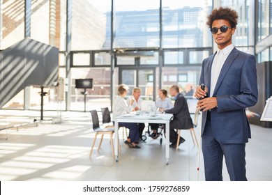 Blind business man with cane in business office for diversity and inclusion