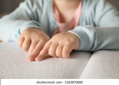 Blind Child Reading Book Written In Braille, Closeup