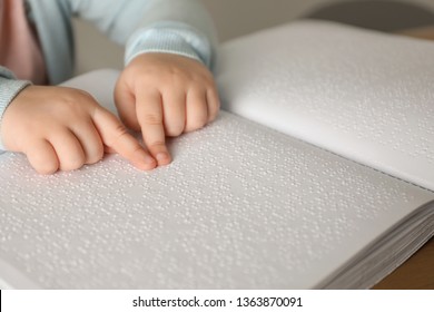 Blind Child Reading Book Written In Braille, Closeup.