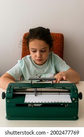 
Blind Child Typing On A Braille Machine.