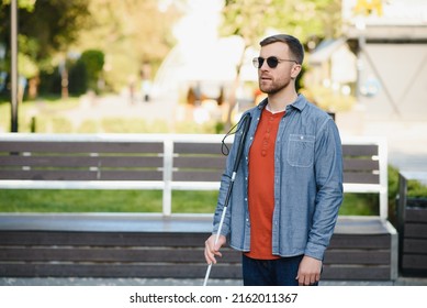 Blind Man. Visually Impaired Man With Walking Stick