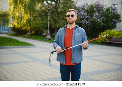 Blind Man. Visually Impaired Man With Walking Stick