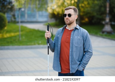 Blind Man. Visually Impaired Man With Walking Stick