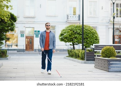 Blind Man. Visually Impaired Man With Walking Stick