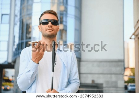 Blind man. Visually impaired man with walking stick