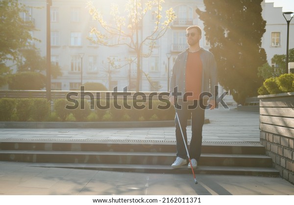 Blind man.
Visually impaired man with walking
stick