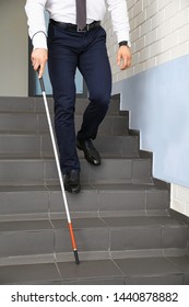 Blind Person With Long Cane Going Down Stairs, Closeup