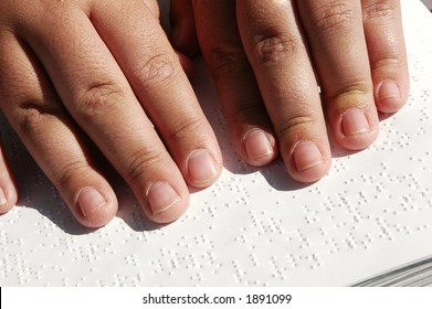 Blind Person Reading Bible Written In Braille