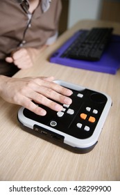 Blind Person Using Audio Book Player For Visually Impaired, Listening To Audio Book On His Computer. Blindness Aid, Visual Impairment, Independent Life Concept. 
