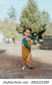 Blind Or Visually Impaired Child (Kid, Toddler, Boy) Exploring Park With White Cane; Independent Exploration; Happy Face; Sunny Day