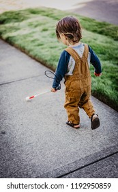 Blind Or Visually Impaired Child/Kid/Toddler/Preschooler/Boy Walking Through Neighborhood With Long White Cane; Back To Camera #2