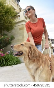 Blind Woman Petting Her Guide Dog