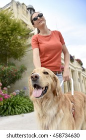 Blind Woman Petting Her Guide Dog