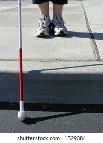 Blind Woman Traveling With White Cane