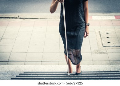 The Blind Woman Walking Up The Ladder