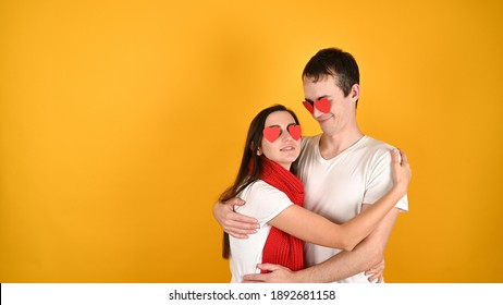 Blinded By Love Couple, On A Yellow Background. High Quality Photo