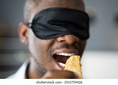 Blindfold Food Taste. African Men Blindfolded Tasting