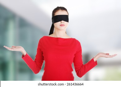 Blindfold Woman Presenting Copy Space On Her Palms