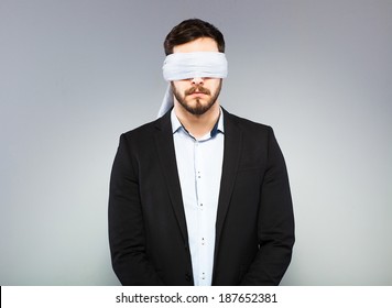 blindfolded office man in black coat
