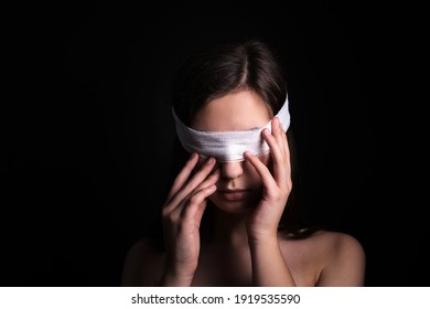 Blindfolded woman closeup. Concept of censorship, human rights, oppression or repression.