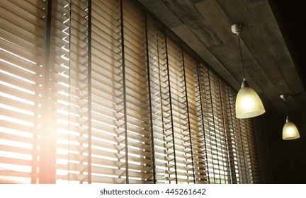 Blinds In A Home Catching The Sunlight With Burst Light