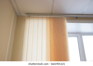 Blinds on the sand-colored window