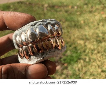 Bling Bling Gold Grillz. Golden Dental Teeth Iced Out Rapper Teeth.