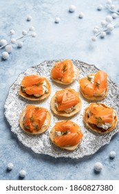 Blini With Smoked Salmon And Sour Cream, Garnished With Dill