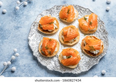 Blini With Smoked Salmon And Sour Cream, Garnished With Dill