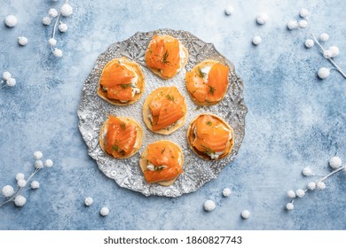 Blini With Smoked Salmon And Sour Cream, Garnished With Dill