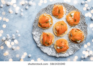 Blini With Smoked Salmon And Sour Cream, Garnished With Dill