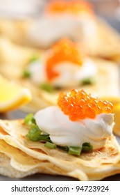 Blinis With Red Caviar On A Plate