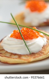 Blinis With Red Caviar On A Plate