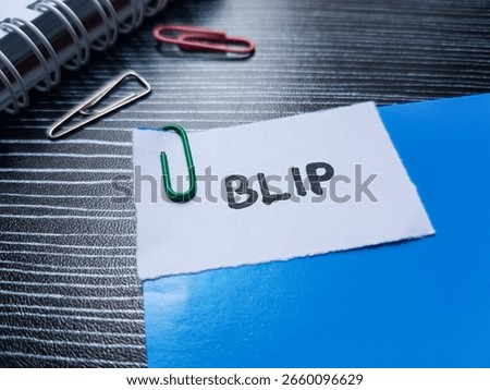 BLIP writting on table background.