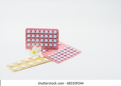 Blister Packaging Of Hormones For Treatment Menopausal Women And Flower On White Background. Hormone Replacement Therapy. Cyproterone Acetate : Steroidal Antiandrogens For Advanced Prostate Cancer.