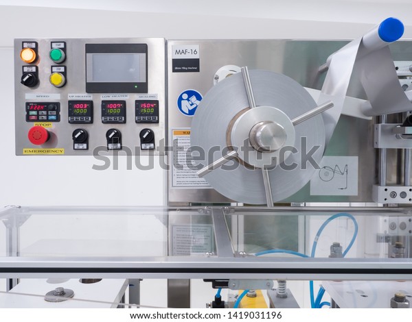 Blister packing machine, white capsules,\
supplement production