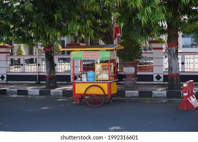 Blitar, East Java, Indonesia - June 1st, 2021 : Es pleret seller (pleret ice) on side road. Es pleret is one of indonesian traditional drink, using palm sugar and coconut milk