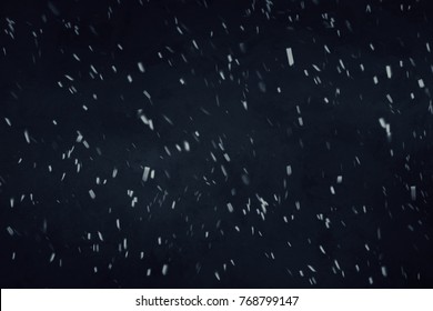 Blizzard On Dark Blue Background. Falling Down In Slow Motion Snowflakes