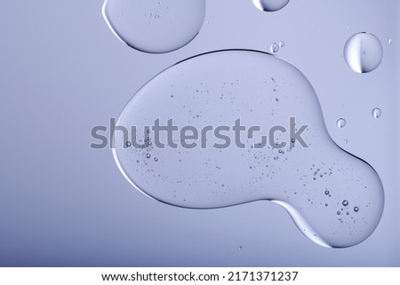 Blob with bubbles and clear formulation on a transparent background. Clear liquid with bubbles resembling glycerin, hyaluronic acid or keratin in laboratory or scientific setting.