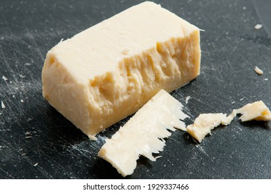 Block Of Aged White Cheddar Cheese Crumbling