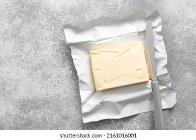 Block Of Butter With Butter Knife In A Open Pack