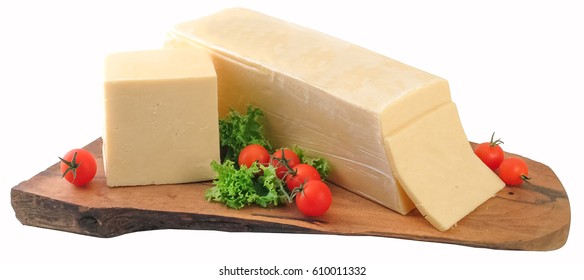 Block Of Cheddar Cheese On Natural Wooden Board.Clipping Path.