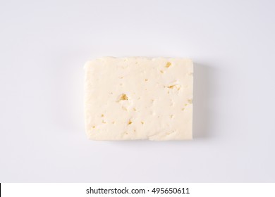 Block Of Fresh Feta Cheese On White Background