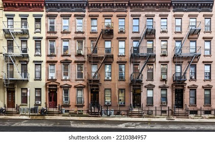Block of historic apartment buildings crowded together on West 49th Street in the Hell's Kitchen neighborhood of New York City NYC - Shutterstock ID 2210384957