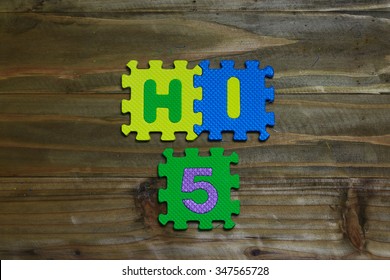 Block Letters And Hi5 On Wood Background