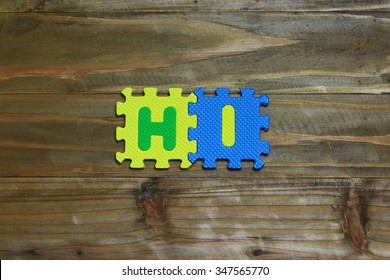 Block Letters And Hi5 On Wood Background