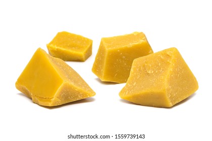 Block Pieces Of Yellow Natural Bees Wax Isolated On White Background.