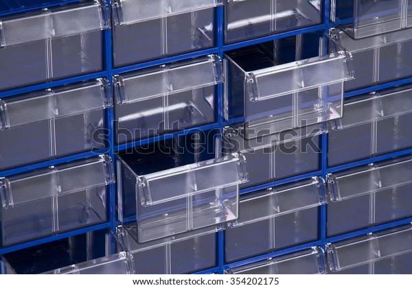 Block of\
plastic containers. Plastic shelves\
organizer